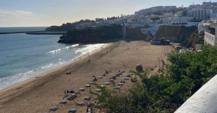Albufeira: Old Town History Walking Tour with Tapas & Wine - Churches, historic buildings, and the town behind the resort