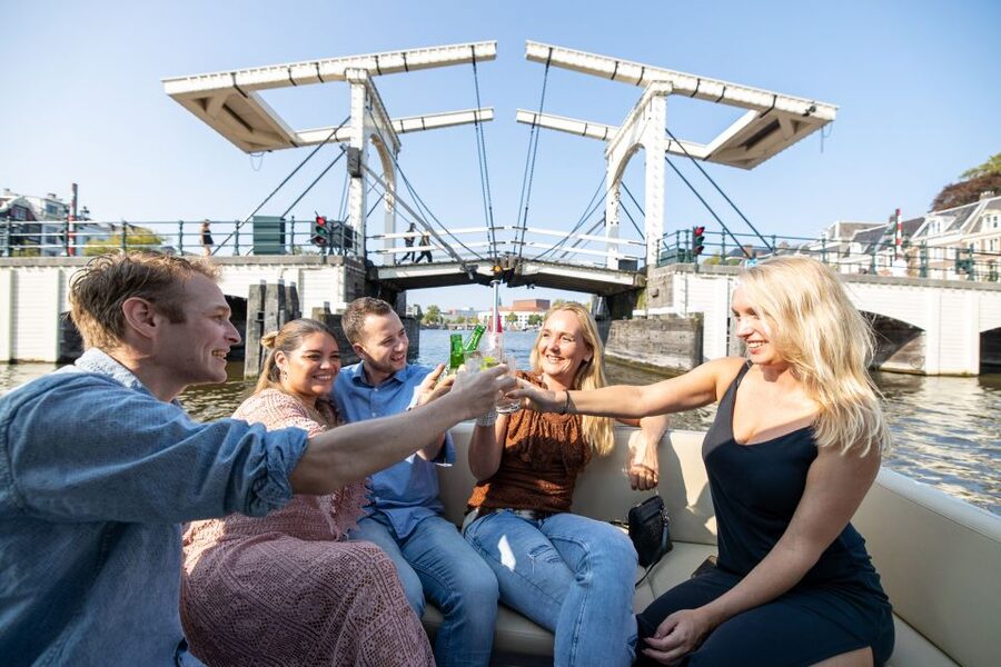 Amsterdam: Historic Boat Cruise with open bar and nibbles - Rain or shine on a historic boat
