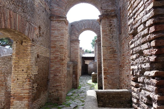 Ancient Ostia Antica Semi-Private Day Trip from Rome by Train with Guide - The Baths of Neptune and their sea-god mosaic