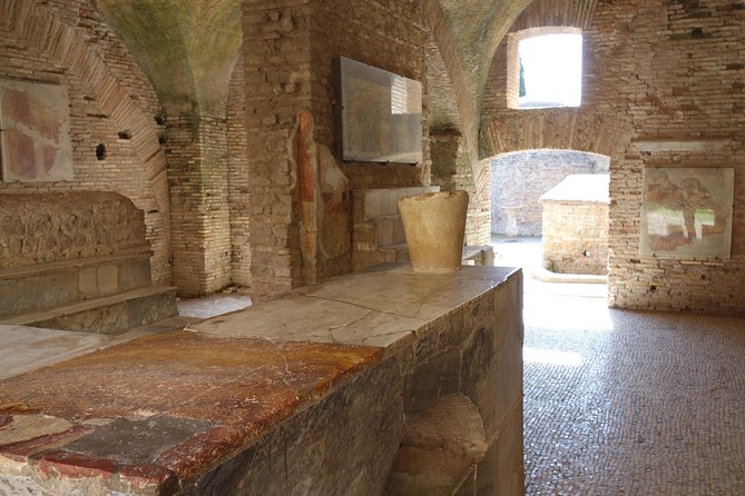 Ancient Ostia Antica Semi-Private Day Trip from Rome by Train with Guide - Sitting in the ancient amphitheater