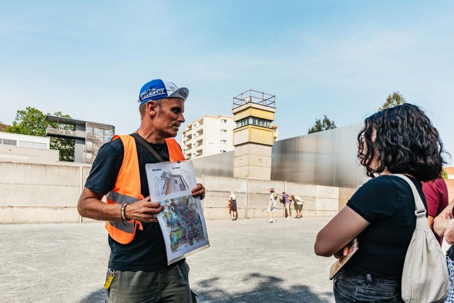 Berlin: Cold War & Berlin Wall History Guided Bike Tour - Checkpoint Charlie and the symbols of the Cold War