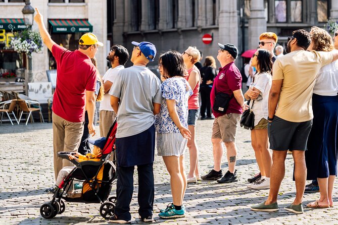 Brussels: Historical Walking Tour with Chocolate & Waffle Tasting - Manneken Pis, a waffle, and a very Belgian joke