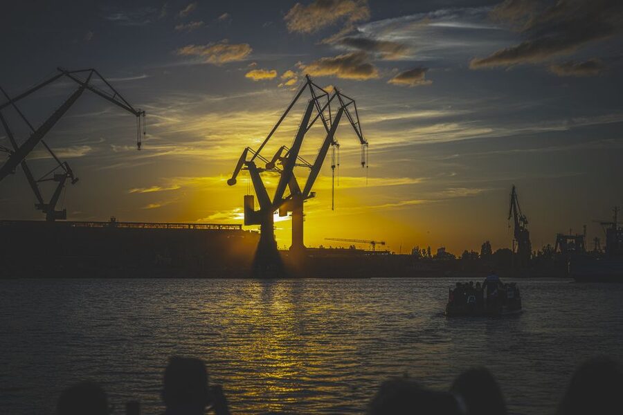 Gdańsk: Sunset Cruise on a Historic Polish Boat - The shipyard at golden hour