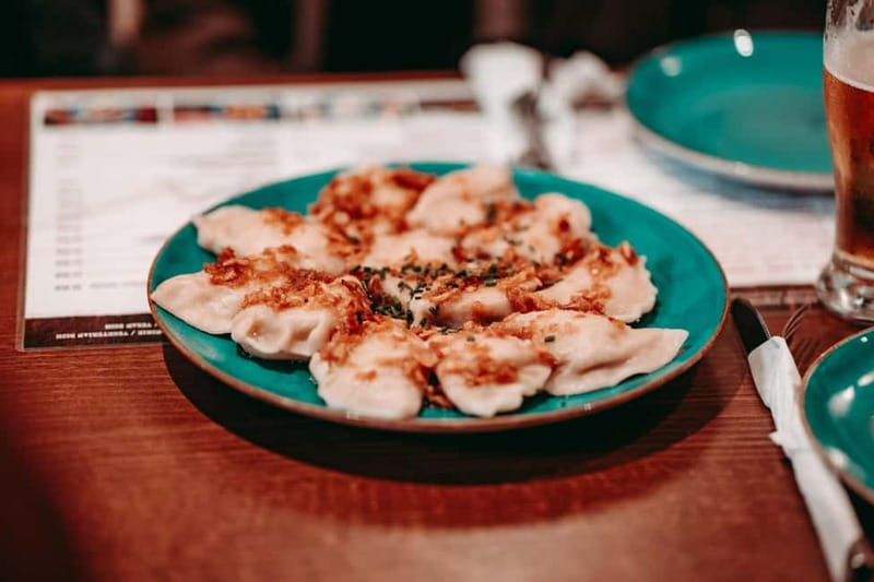 Krakow: Tipsy Polish Food Tour With History, Pierogi & Shots - The Polish shot tasting and the pace of the evening
