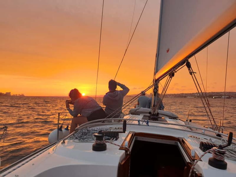 Lisbon: Daytime or Sunset Boat Cruise with History and Wine - Under the 25 de Abril Bridge toward Cristo Rei