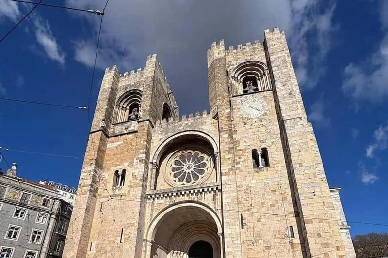 Lisbon: Live Fado Show in Historic Alfama with Port Wine - Entering the historic Alfama setting