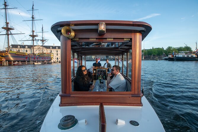 Private Boat Tour Amsterdam - 90 Min incl. welcome drink on historic saloon boat - Leaving from Oosterdokskade 8