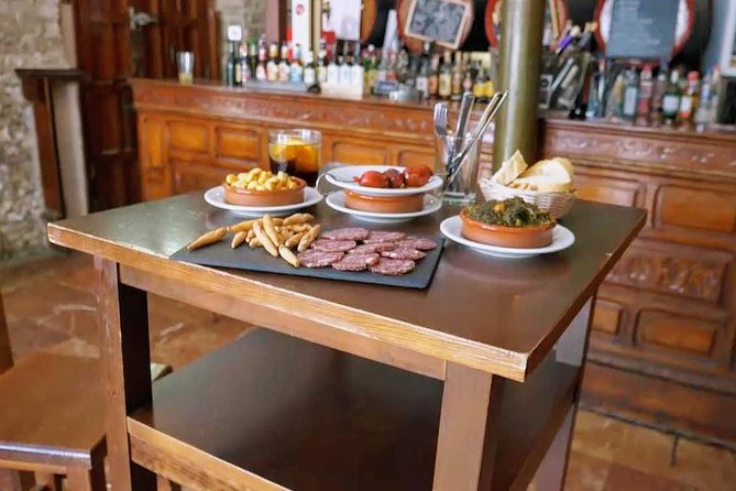 Sevilla Food Tour: Tapas, Wine, History & Traditions - Santa Cruz: meatballs, pestiños, and PX