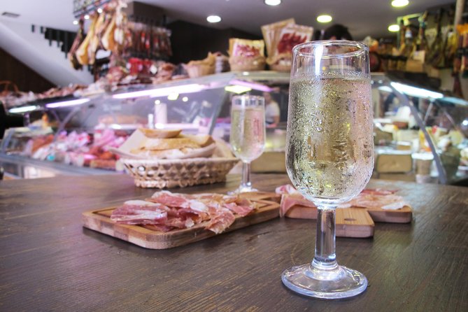 Taste of Malaga Tour : Tapas, History and Local Customs - Iberian ham and vermouth at a traditional ultramarinos